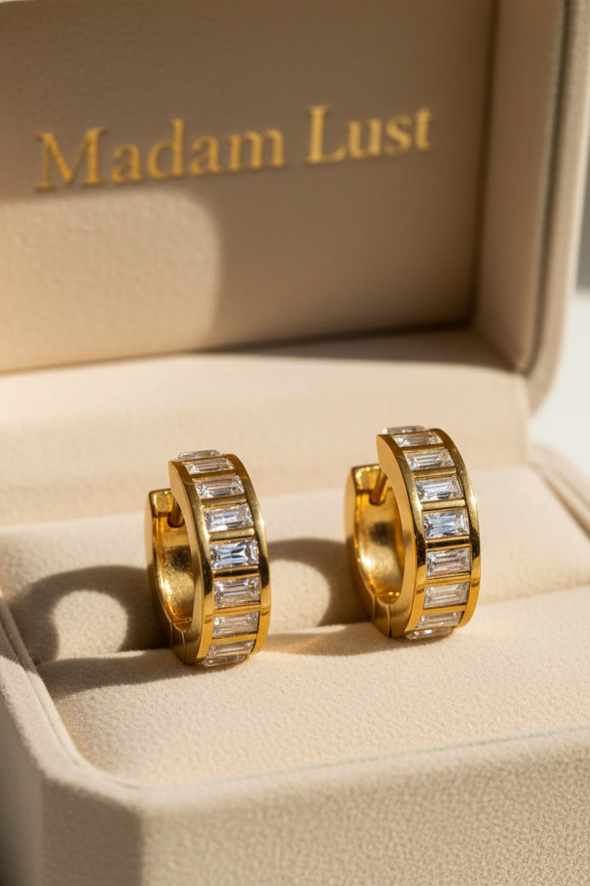 18K gold baguette crystal huggie earrings  in Madam Lust box — gold plated vs solid  gold jewelry comparison guide